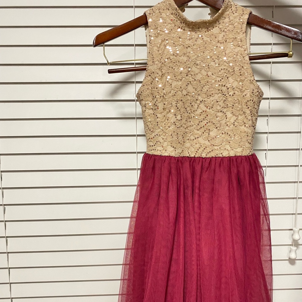 Brand new size 7 high low dress gold/maroon